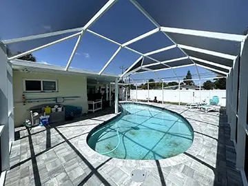 White pool enclosure with mansard roof - Daytona Beach